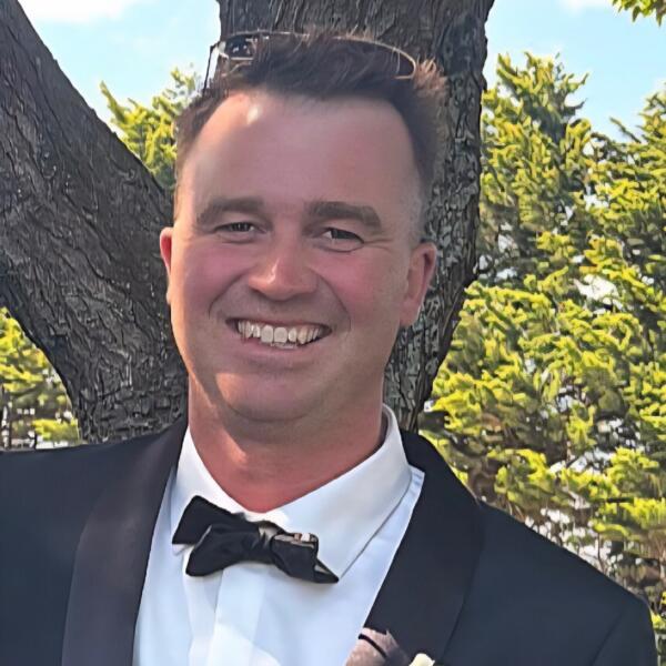Headshot image of MUGAVIN, Leigh Barry
